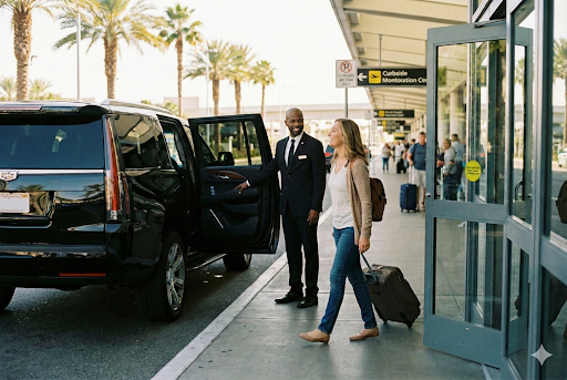 Business traveler greeting private airport chauffeur in San Diego